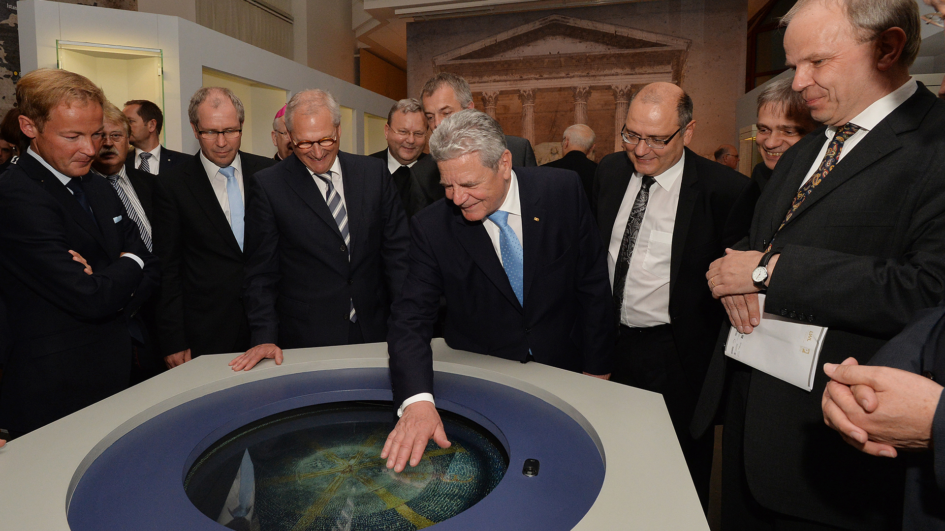 joachim gauck tests interactive baptismal font at diocesan museum paderbron